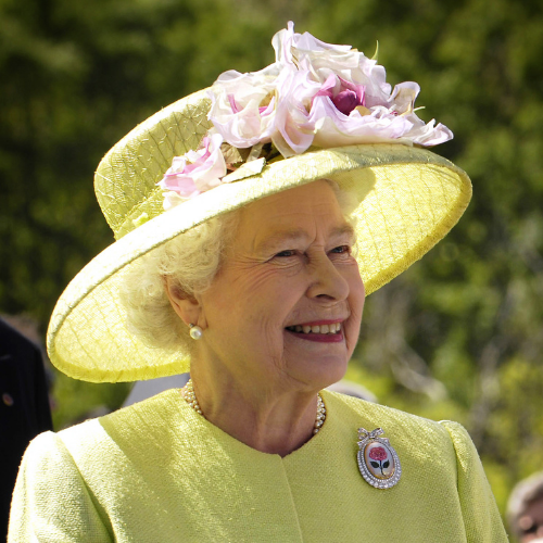 5 events to look out for: The Queen's Royal Photographers. Portrait photograph of the Queen smiling, wearing a lemon coloured suit and a matching hat with light pink flowers. 