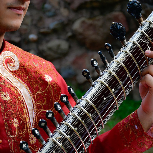 5 events to look out for: An Insight into Indian Classical Music. Close-up image of a musician playing the sitar.