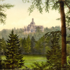 Autumn brochure: Painting of St. Michael's Abbey in the distance. Green foliage and trees in the foreground.